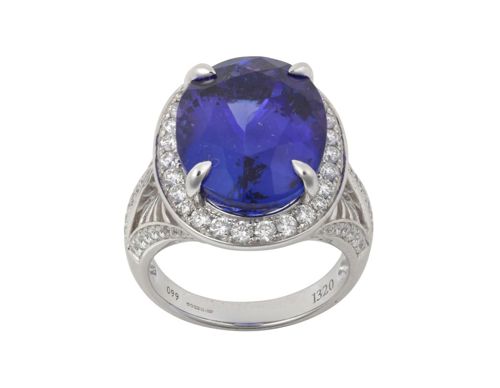 An 18 Carat White Gold Tanzanite and Diamond Cluster Ring